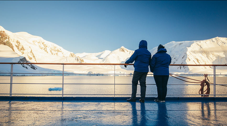 2 people gaze on the Antarctic landscapes on an Antarctica Cruise