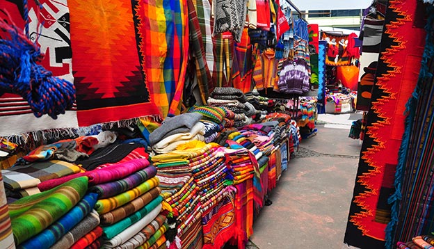 View of stalls in traditional market - Otavalo, Ecuador View of stalls in traditional market - Otavalo, Ecuador