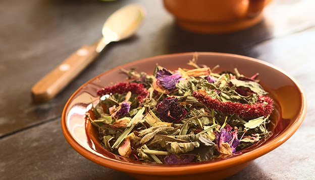 Horchata – a traditional Ecuadorian tea made of 28 different herbs in a bowl