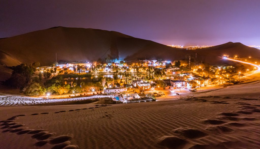 Climbing up the sand dunes here in Huacachina/Peru in order to take a nice landscape picture of this Oasis - Climbing up the sand dunes here in Huacachina/Peru in order to take a nice landscape picture of this Oasis -