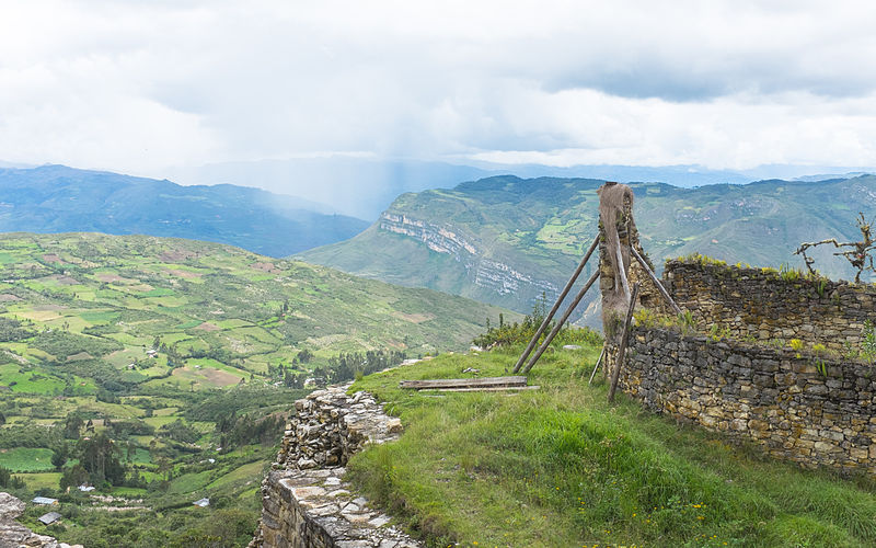 view from the kualap fortress in peru over mountains and green fields view from the kualap fortress in peru over mountains and green fields