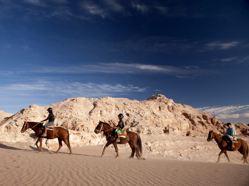 Horse riding at Valle de la Luna in the Atacama Desert Horse riding at Valle de la Luna in the Atacama Desert