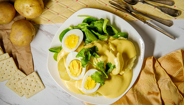 Papa a la HuancainaPeruvian potatoes and hard boiled eggs with spicy aji amarillo yellow sauce. Papa a la HuancainaPeruvian potatoes and hard boiled eggs with spicy aji amarillo yellow sauce.