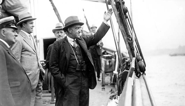 Sir Ernest Shackleton waving goodbye as he departs for his final mission. Photo Credit: Getty Images