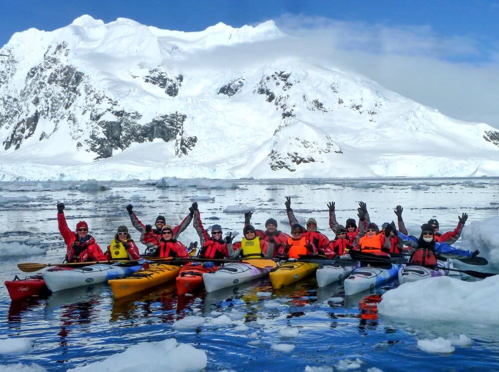 group of kayakers in Antarctica