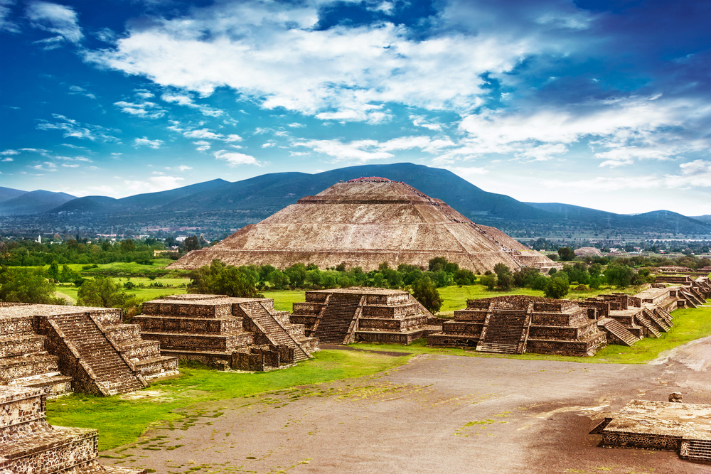 The Teotihuacan Pyramids; ancient pyramids with mountains in background The Teotihuacan Pyramids; ancient pyramids with mountains in background