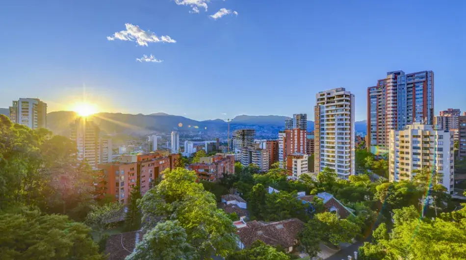 Medellin panoramic city view at sunrise with blue sky and skyscrapers