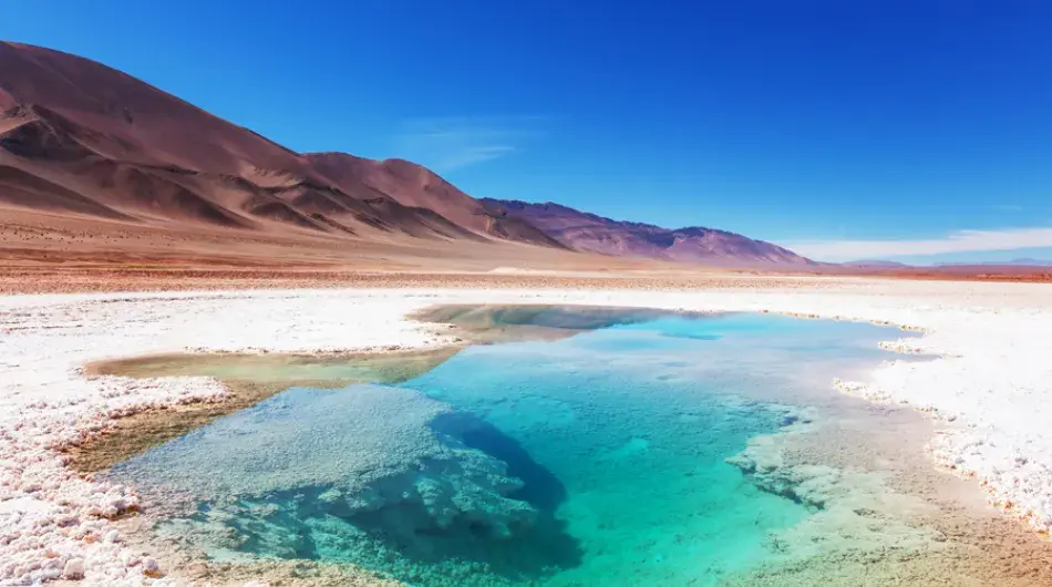 Jujuy salt desert with blue water pool