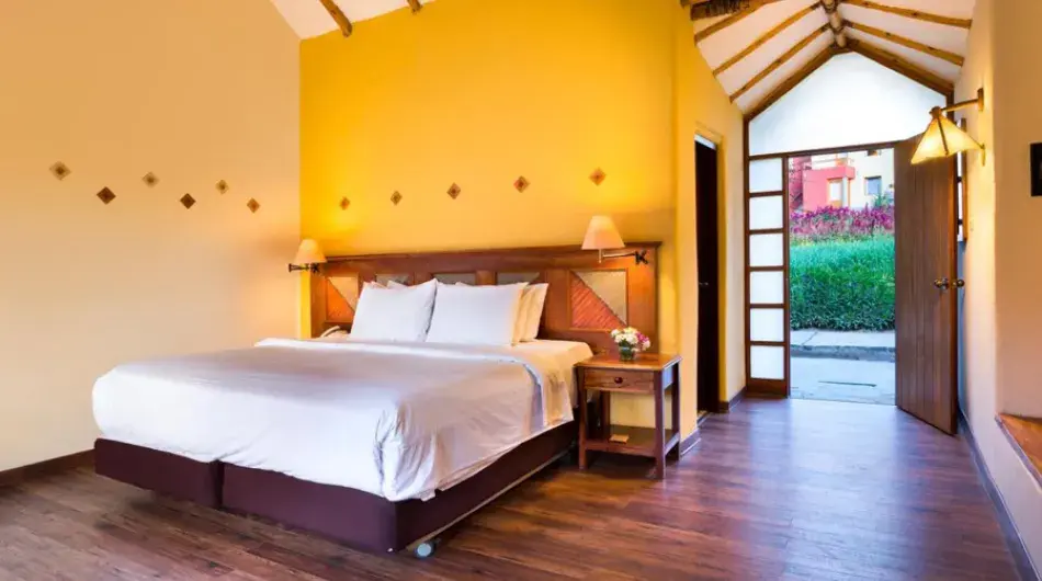 Colca lodge hotel room with matrimonial bed and yellow walls