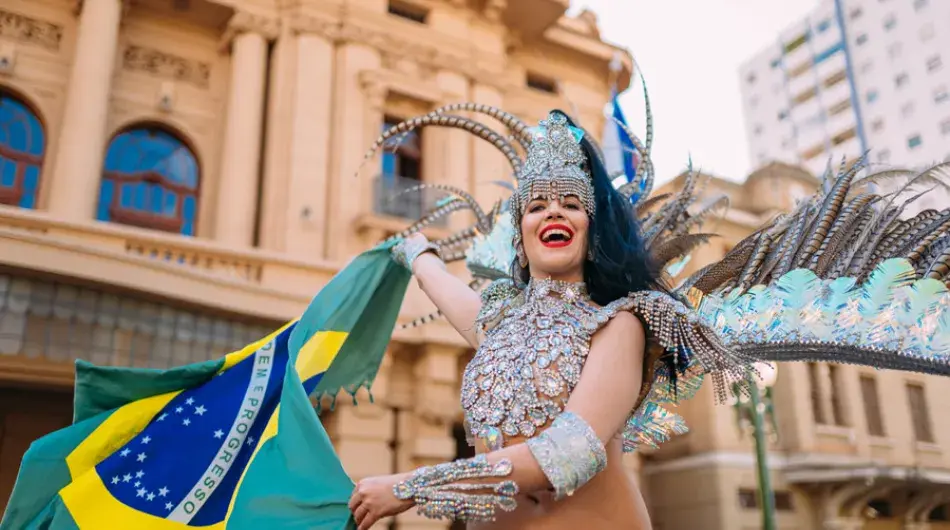 Samba dancer waiving brasilian flag