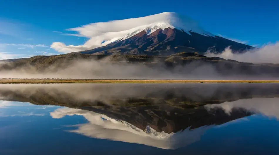 Cotopaxi volcano reflecting on a lagoon