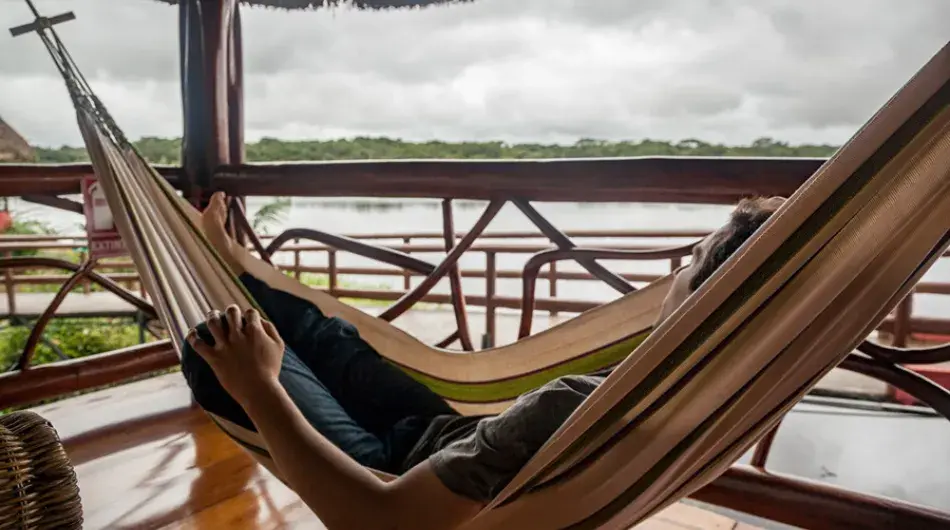 Tourist in a hammock at Napo wildlife center, Ecuador