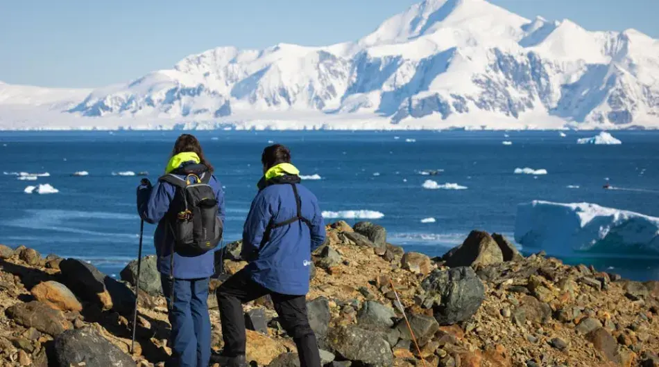 Tourist hiking in Antarctic landscape