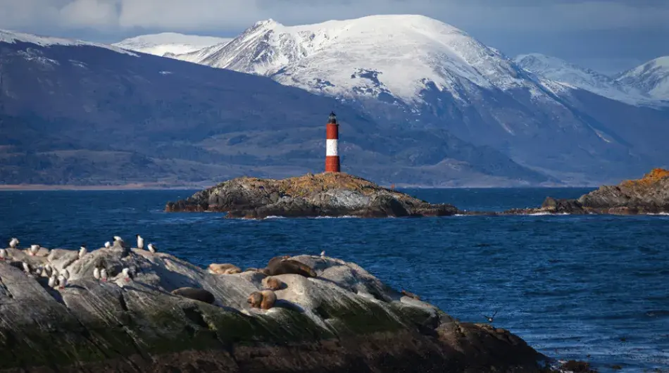View of Beagle Channel Lighthouse in front of a Mountain Scenery