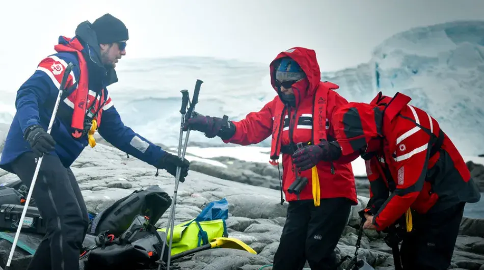 Expedition crew assisting with hiking on Antarctica Cruise