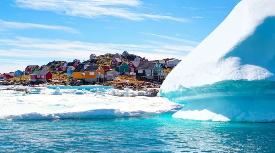 Kulusuk Village, Greenland with icebergs in the foreground