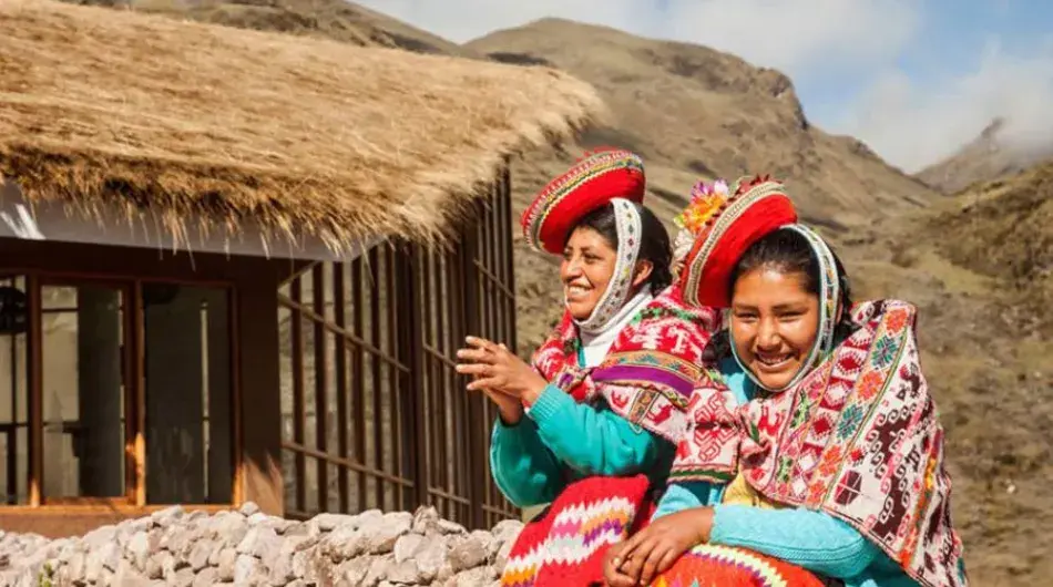 Two young Peruvian ladies in colorful traditional Andean outfit