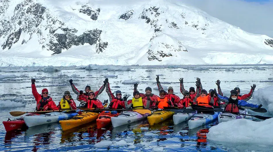 group of kayakers in Antarctica