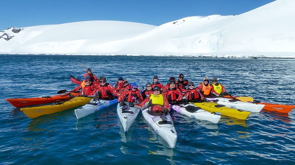 group of kayakers in Antarctica