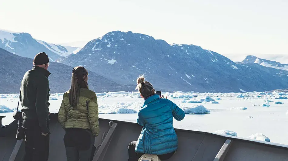 M/S Balto - guests on the front deck looking at Arctic landscapes 