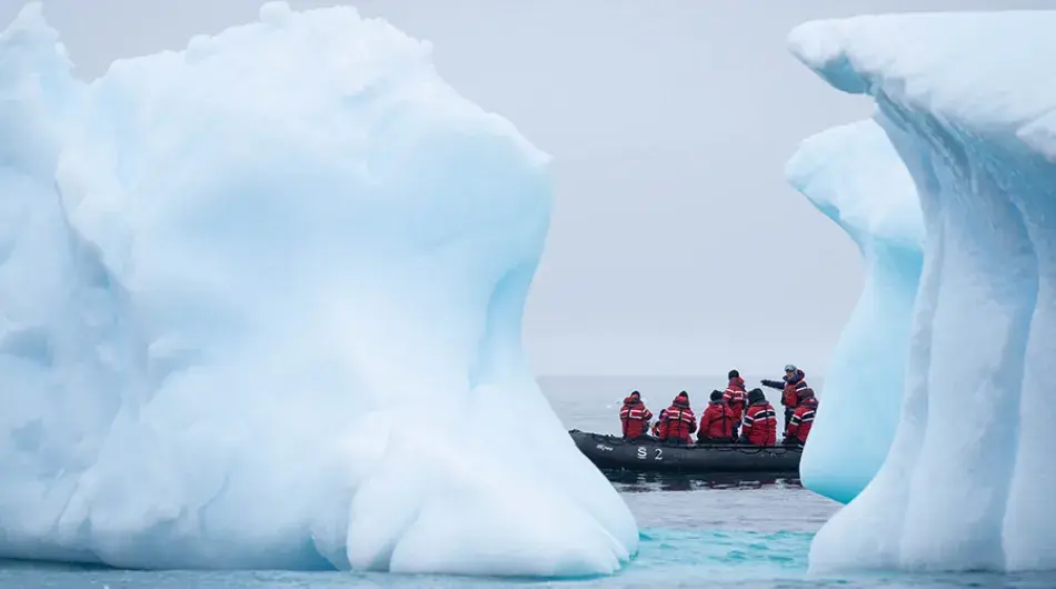 zodiac cruising between icebergs in Antarctica, Fournier Bay