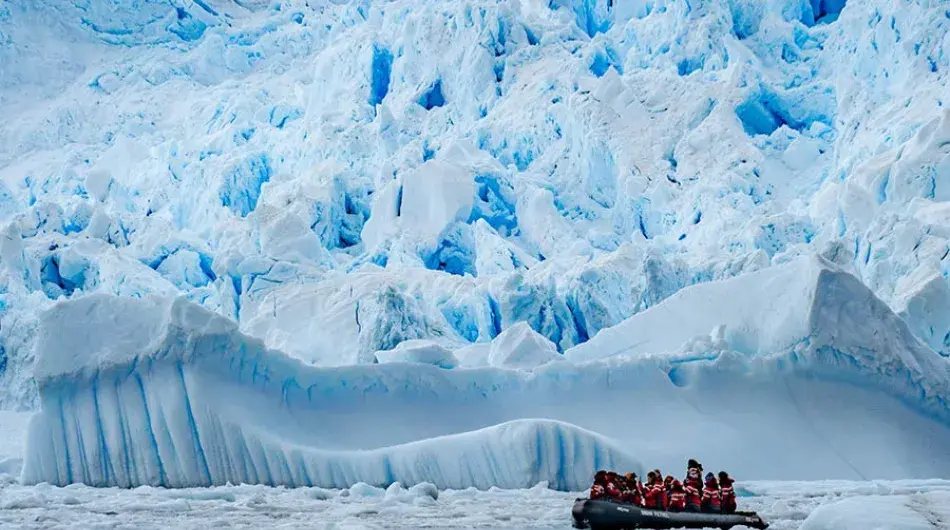 Zodiac cruise in Antarctica with iceberg
