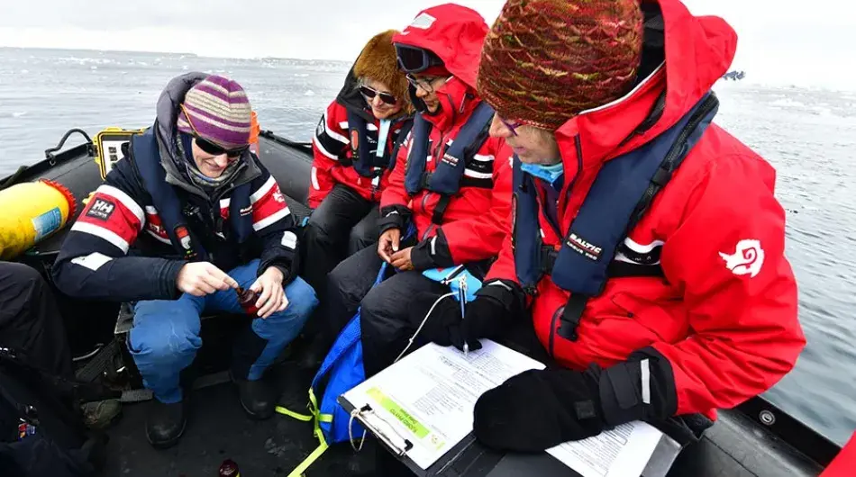 Passengers undertaking Citizen Science experiment on Antarctic expedition cruise