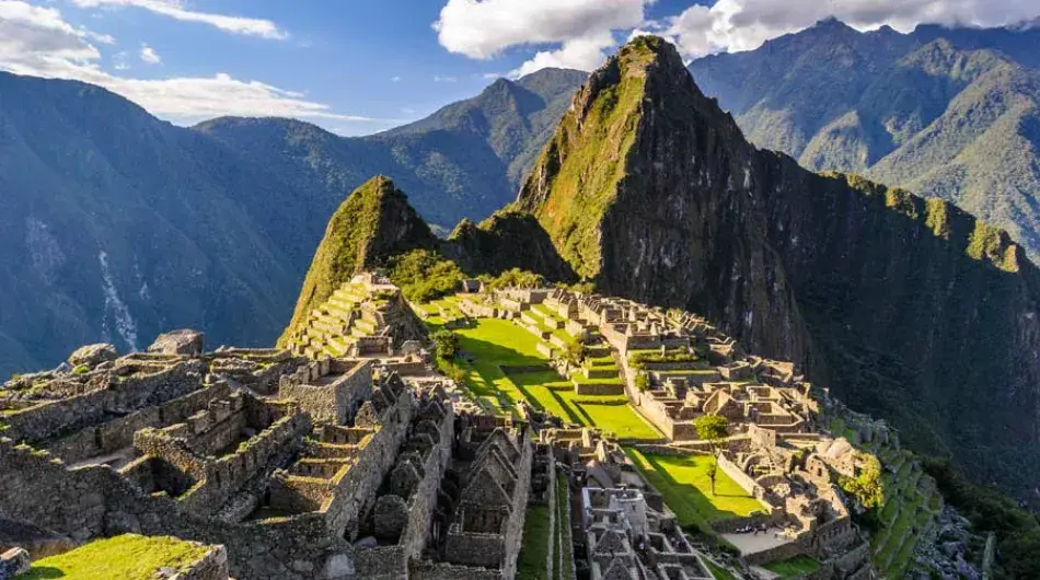 Machu Picchu archaeological site on a sunny day with blue sky