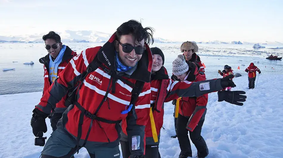 guests on an expedition cruise landing in Antarctica 