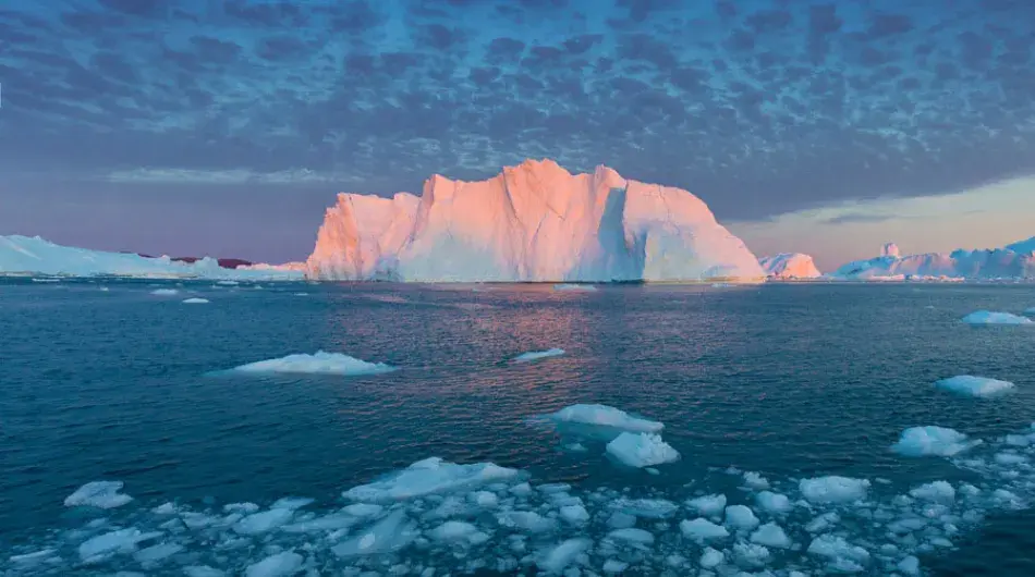 Sunset on iceberg in Disko Bay in Greenland 