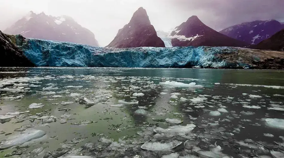 icy waters and glacier in Kangerlussuatsiaq Fjord in Greenland 