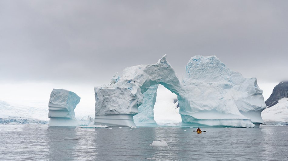 PL-Antarctica-iceberg-arch-kayaker