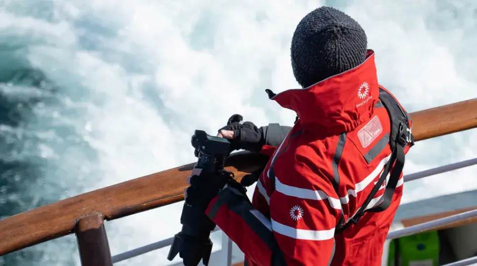 Client at sea with camera