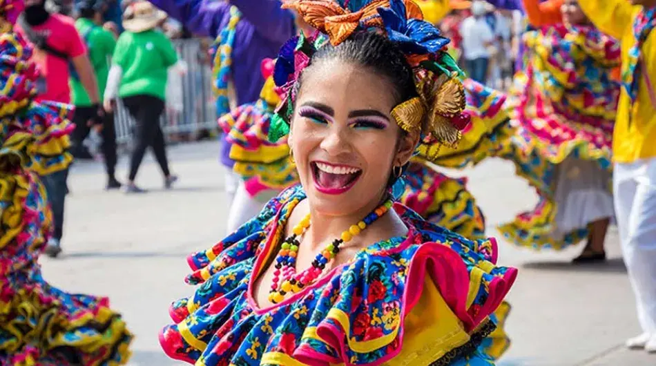 Colombian lady in a colourful dress celebrating Carnaval