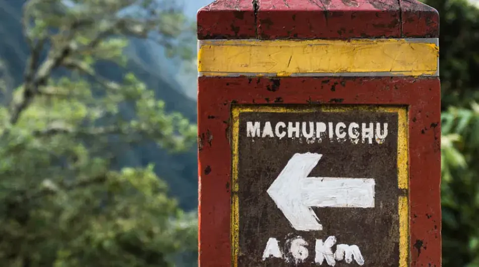 Sign on Inca Trail pointing to Machu Picchu