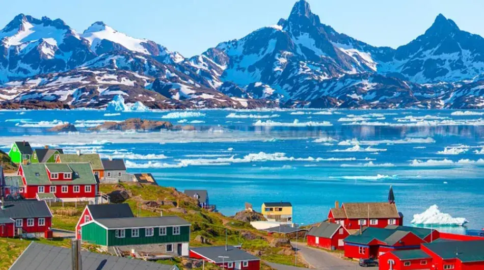Tasiilaq village in East Greenland with icebergs in bay