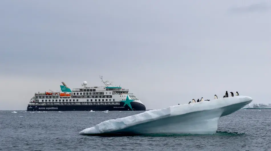 Douglas Mawson Ship exterior with penguins on an iceberg