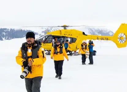 Tourists landing at Snow Hill in Antarctica by helicopter with photo by Michelle Sole) 
