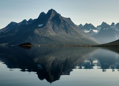 Still water reflection of a bay in Tesermiut Greenland) 