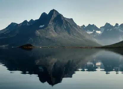 Still water reflection of a bay in Tesermiut Greenland) 