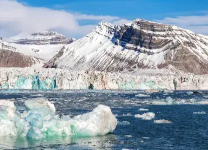 Kongsfjorden-svalbard-HERO.jpg Kongsfjorden svalbard panoramic landscape with iceberg in the foreground)